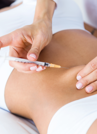 Close-up of a clinician administering a Profhilo body treatment injection into a patient's abdomen.